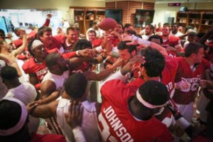 Sooners teammates congratulate QB Blake Bell following Oklahoma's 51-20 win over Tulsa.